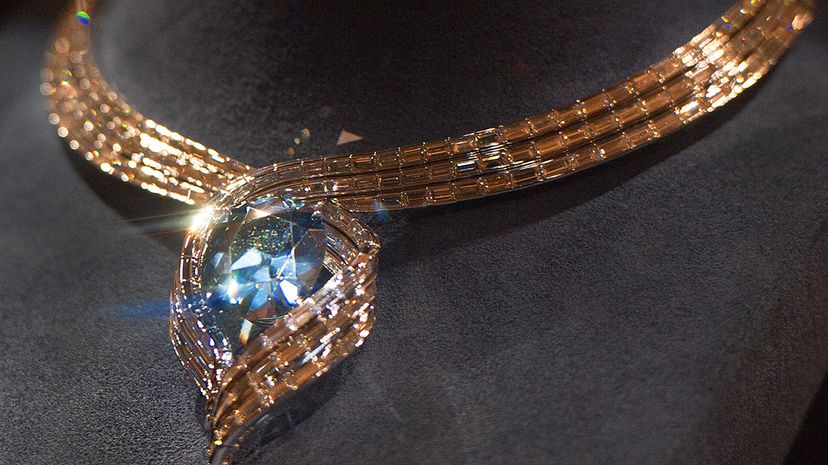 The Hope diamond has passed through many hands in the years since it was created. Here, the diamond is displayed in a temporary setting, in the National Museum of Natural History. PAUL J. RICHARDS/AFP/Getty Images