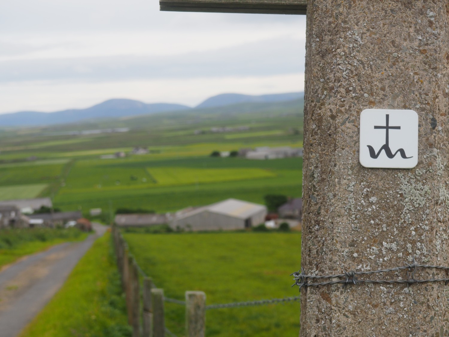 Small sign post to mark the St Magnus Way path in Orkney